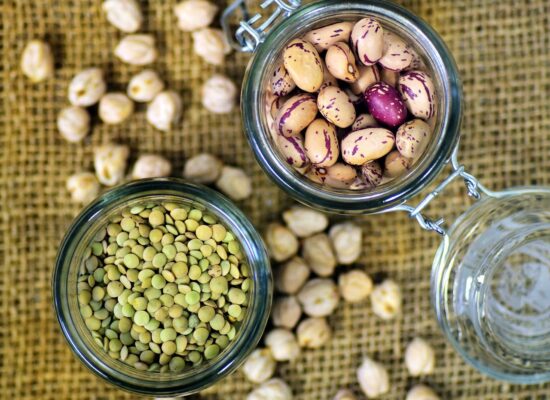 Glass containers of nuts, beans, and seeds