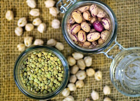Glass containers of nuts, beans, and seeds