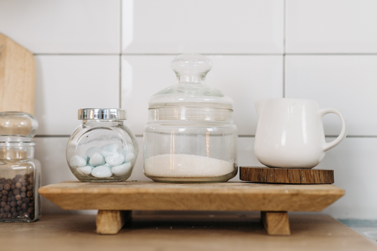 Containers of a variety of sugars such as cane sugar, granulated sugar, and candy