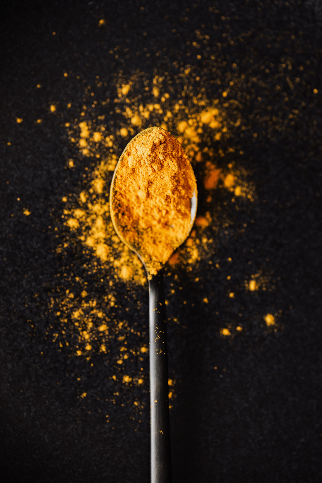 Spoon of turmeric spice