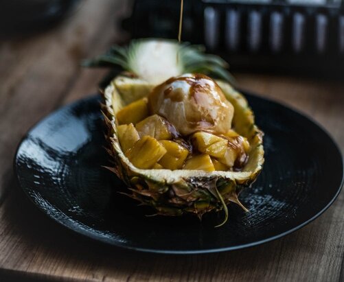 Pineapple chicken served on a ceramic plate