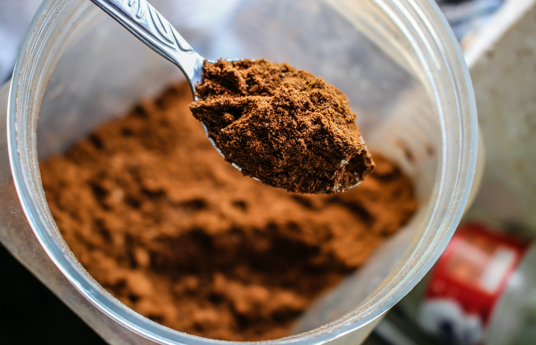 Scooping out chocolate protein plant based protein powder